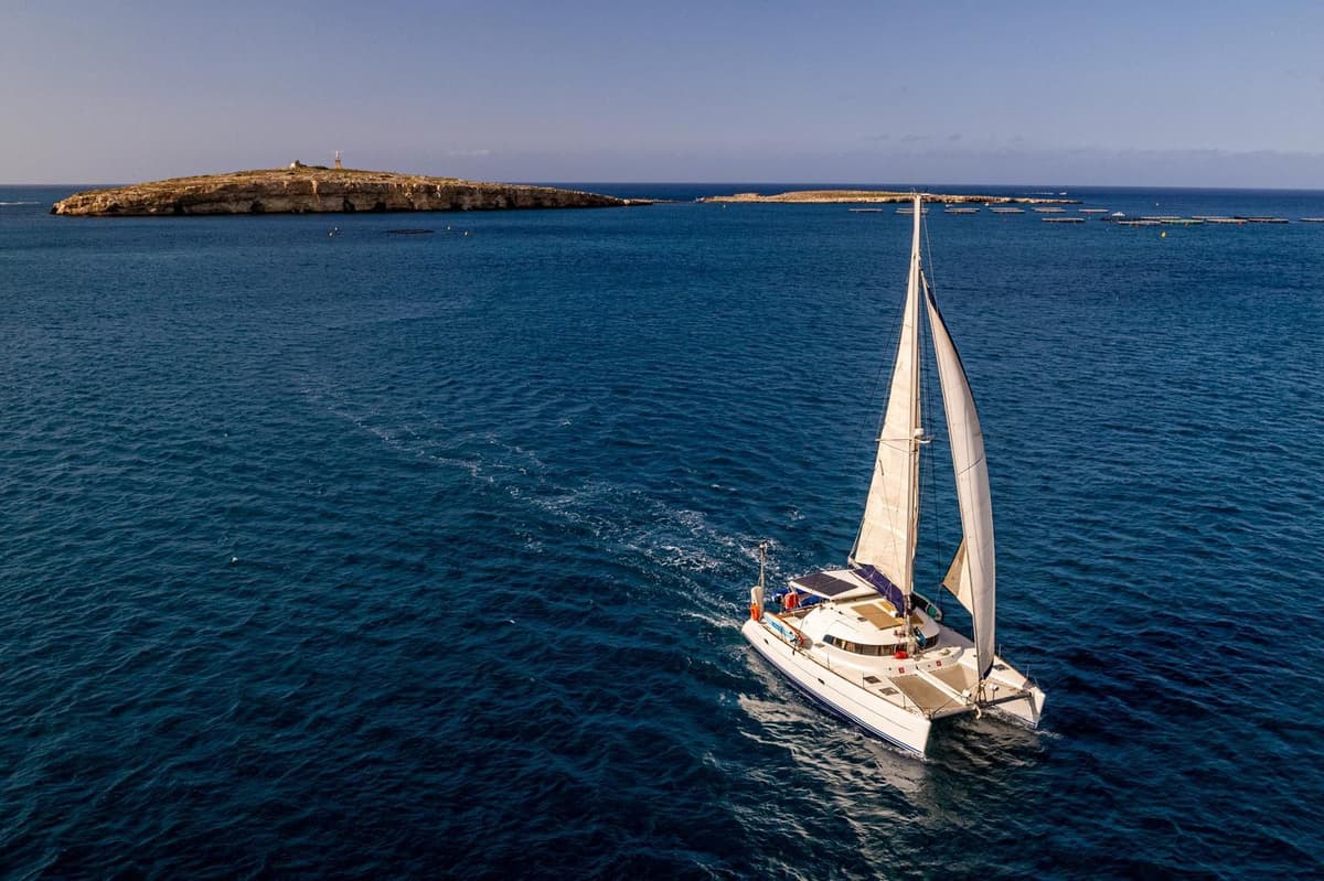 Sailing catamaran on the open sea off Malta